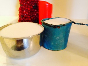 For comparison, the blue cup is a measuring cup from my grandmother's days as a chuch wagon cook. Grandad made it for her from a can. It only holds about 7/8 a cup of sugar, and was painted with lead paint.